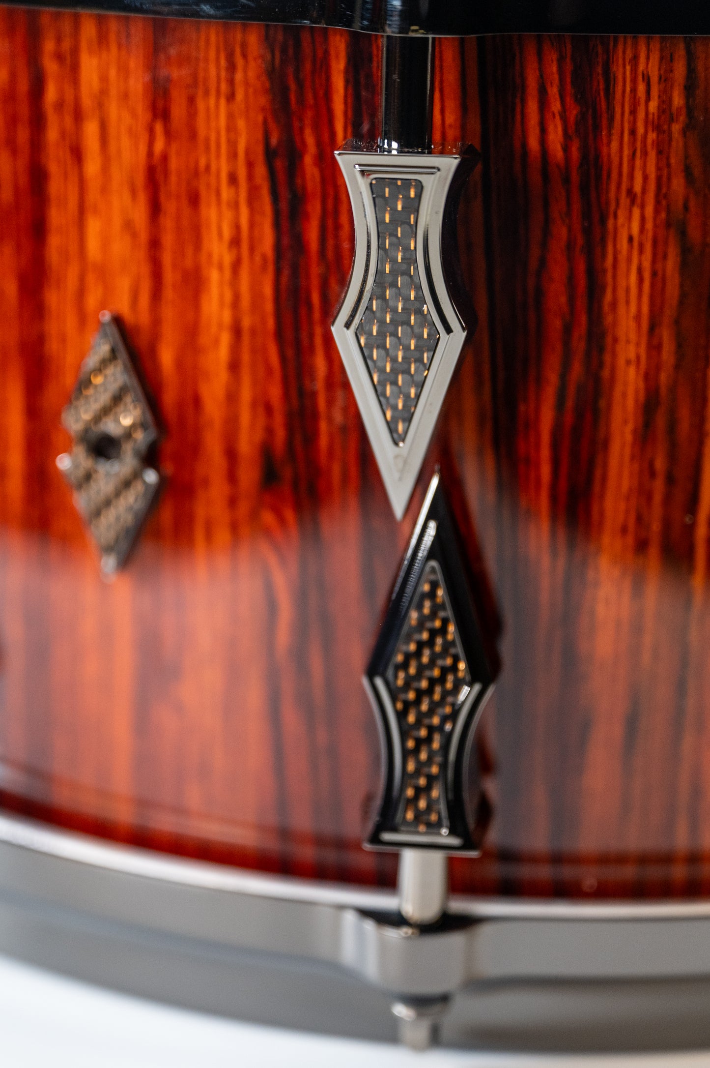 Cocobolo 10 Lug Stave Snare Drum 7.5''x14'' High Gloss Finish with Black Chrome Lugs and Copper Lightning Strike Carbon Fiber Inlays